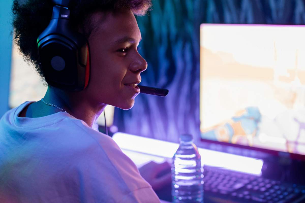 A gamer dude sitting in front of his computer